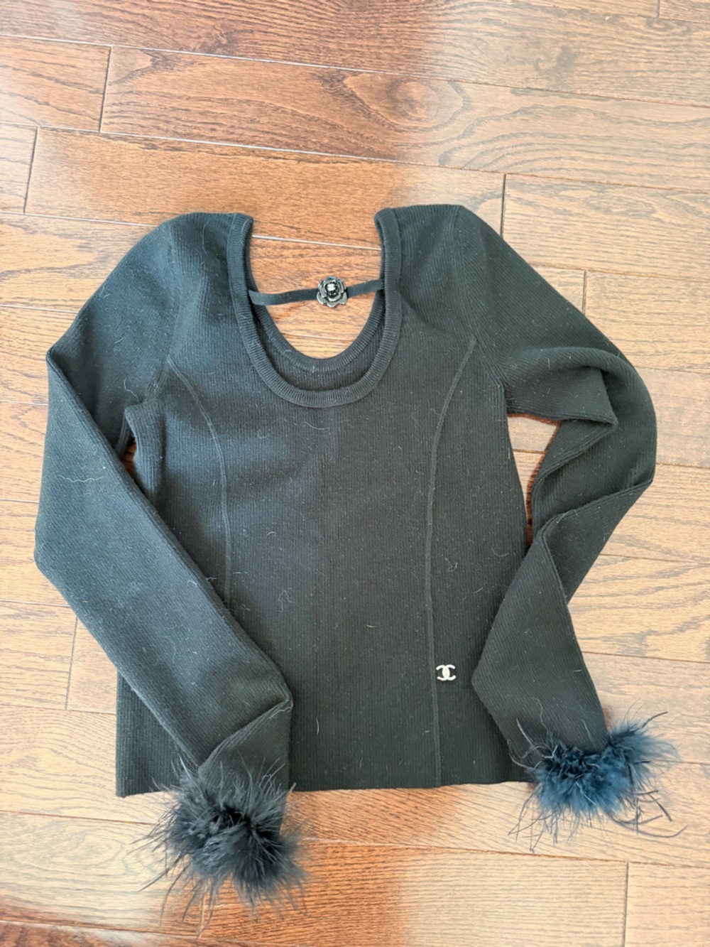 CHANEL Black Ribbed Knit Beanie with Feather Pom-Pom arm detail 
Size large